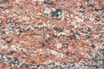 Aged brown granite background with scratches. Natural granite.