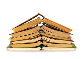 A stack of old books isolated on white background