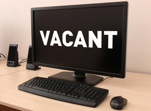 Office workplace with vacant sign