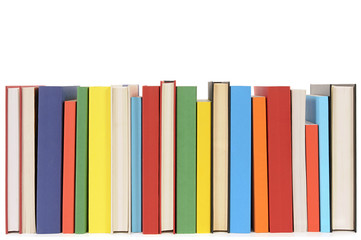 Small row line of colorful books spine facing library collection isolated white background photo