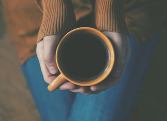 cup of coffee in hands