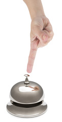 Hand of a woman ringing hotel bell isolated on white