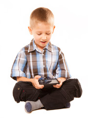 Little boy playing games on smartphone