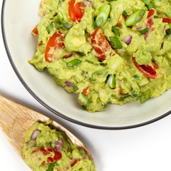 Guacamole on white background. Selective focus.