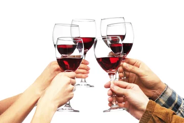 Acrylic prints Wine Clinking glasses of red wine in hands isolated on white