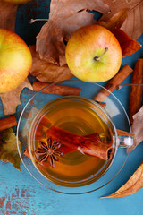 Composition of  apple cider with cinnamon sticks, fresh apples