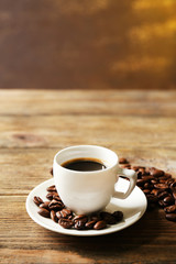 Cup of coffee on wooden table