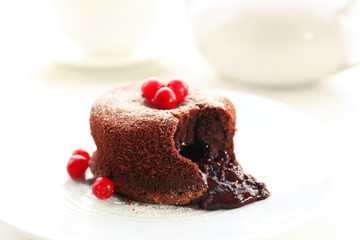 Hot chocolate pudding with fondant centre on plate, close-up