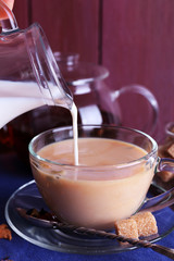 Pouring milk © Africa Studio
