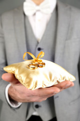 Man holding wedding rings close up