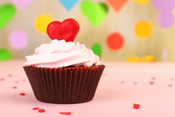Delicious cupcake for Valentine Day on bright background