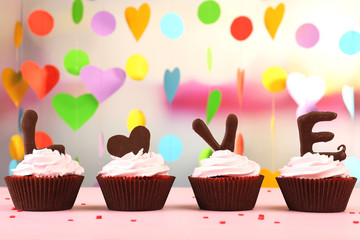 Delicious cupcake for Valentine Day on bright background