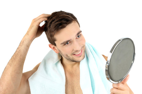 Handsome Young Man With Towel Holding Mirror Isolated On White