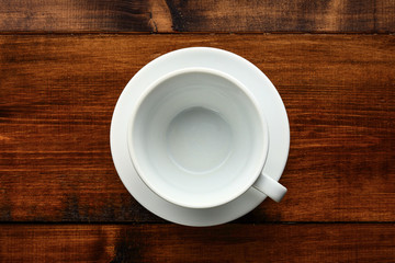 white cup in wood table