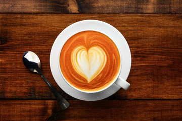 cup of cappuccino on a wooden table
