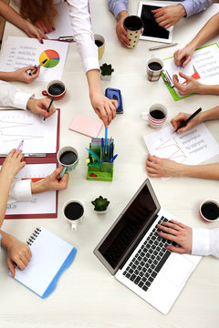 Group of business people working at desk top view