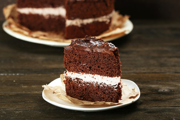 Delicious chocolate cake on table close-up