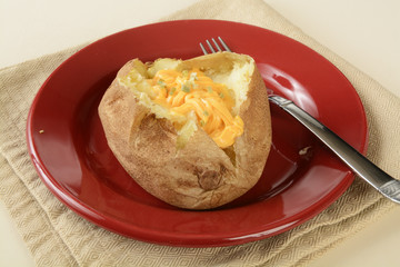 Baked potato with cheese and chives
