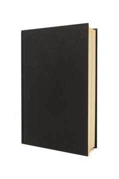 Plain black hardback book or bible isolated on white background photo