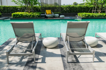 Swimming pool with beach chairs