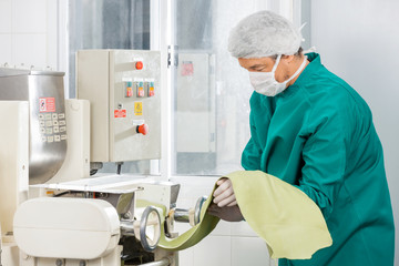Chef In Protective Workwear Processing Spaghetti Pasta Sheet