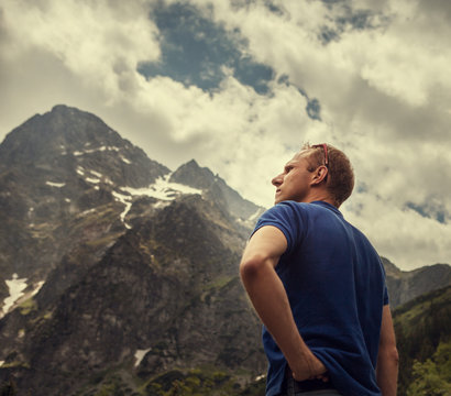 Man portrait on the mountain peaks view