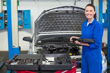 Mechanic smiling at the camera