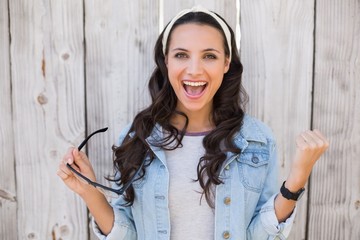 Pretty hipster cheering and smiling