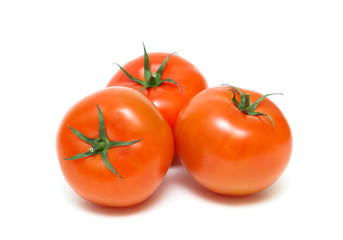 three ripe tomatoes closeup isolated on white background