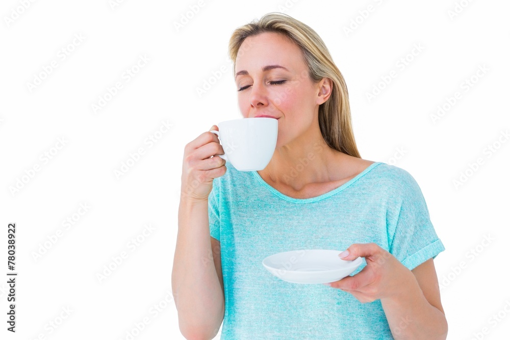 Poster Peaceful blonde drinking hot beverage with eyes closed