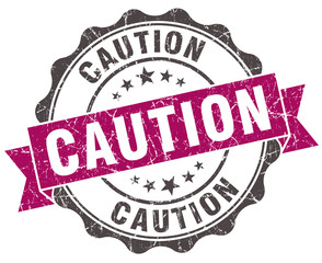 caution grunge violet seal isolated on white