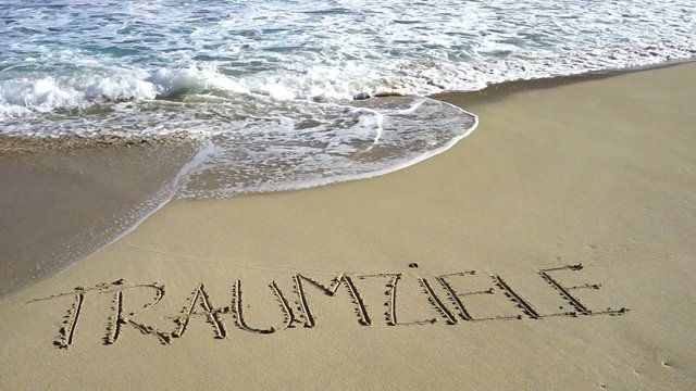 Wort Traumziele in Sand gezeichnet