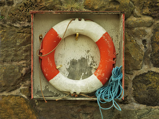 Life ring in harbour wall
