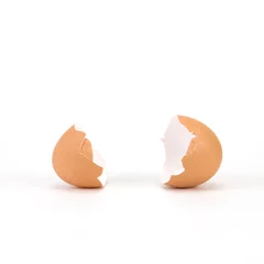 Tuinposter broken and cracked egg shell on white background © Cozine