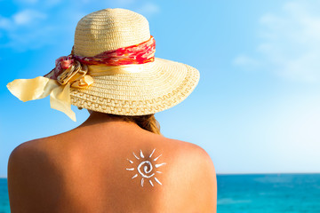 Suntan lotion woman with sunscreen solar cream