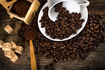 coffee beans with grinder and coffee cup