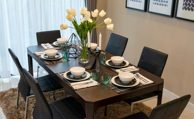 dining table and comfortable chairs in modern home with elegant