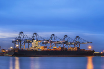 Fototapeta na wymiar Container Cargo freight ship with working crane bridge