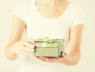 woman hands with gift box