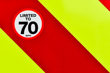 Vehicle speed restricted sign on high vis chevrons