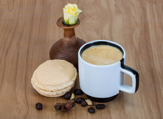 Coffee with macaroons and rose