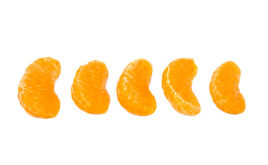 Five slices of ripe and fresh mandarin or tangerine isolated on