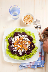 vegetarian salad with beet and roasted pumpkin. served with pine