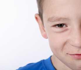Obraz premium Photo of adorable young happy boy looking at camera.
