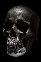 Scary human skull, crying blood