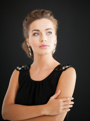 woman with diamond earrings