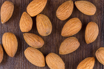 Almonds on the wooden background