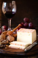 Italian Taleggio cheese with walnuts, honey and grapes