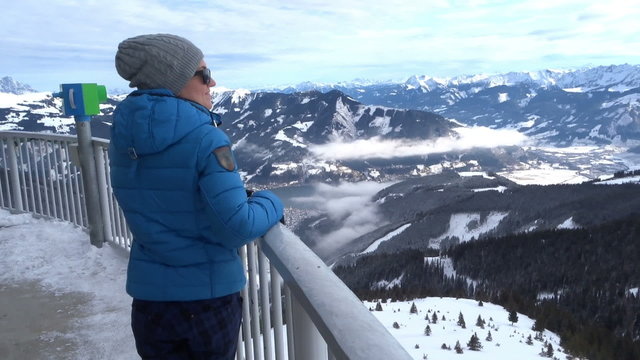 Woman in the mountains looking at beautiful view, Alps