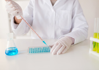 close up of scientist making test in lab